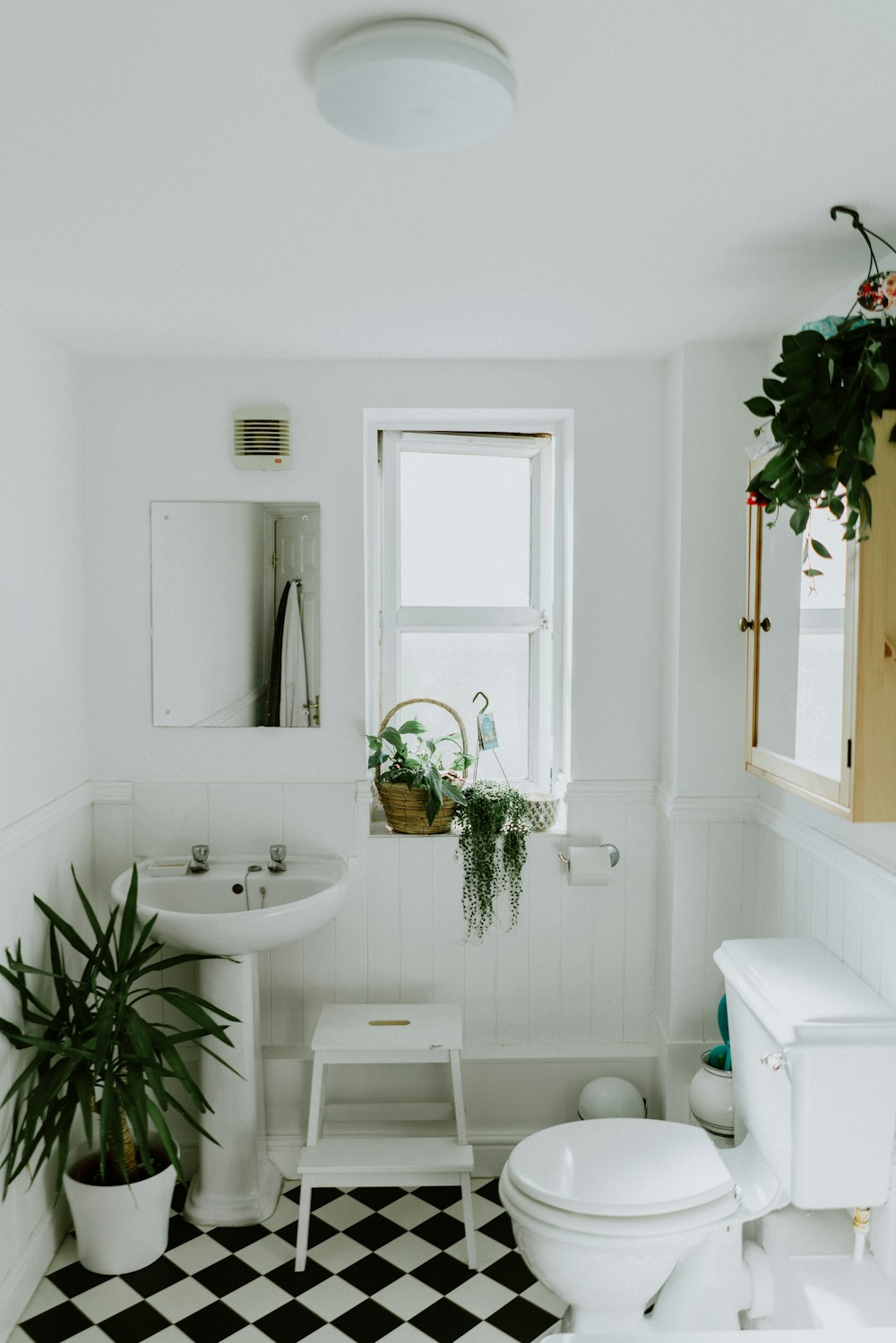 Immaculately clean white bathroom with fresh towels
